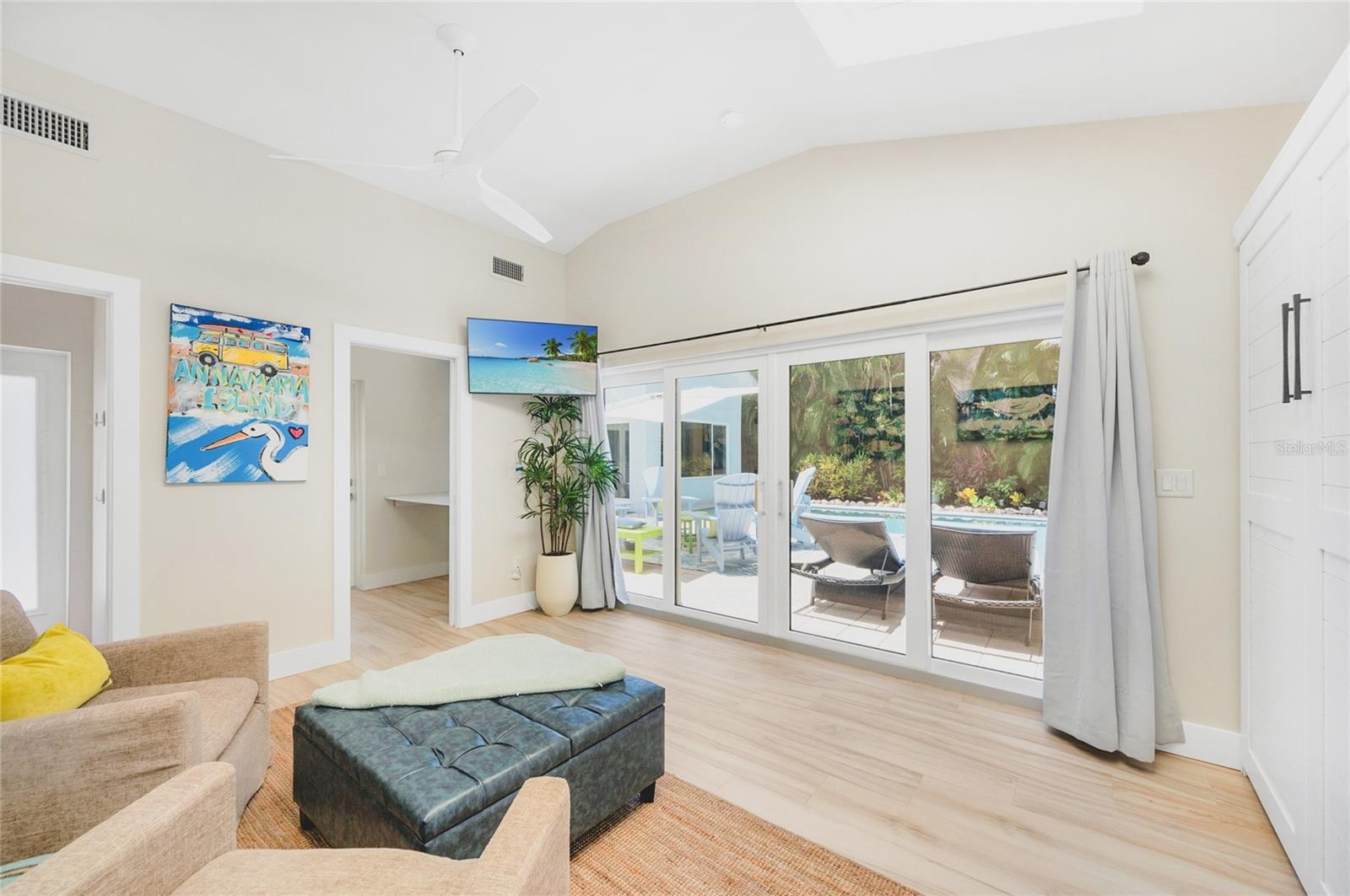 The Casita boasts a wall of sliding doors with tropical and pool views