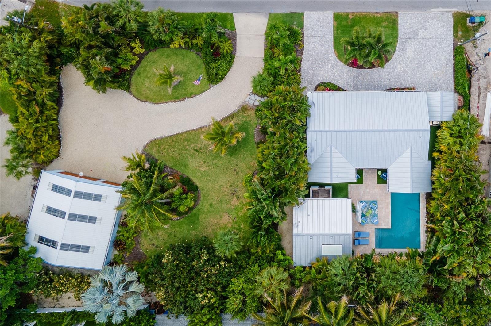 Aerial view showing 242 Gladiolus and the adjacent parcel at 240 Gladiolus which is beautifully landscaped and has a large garage.  240 Gladiolus is a