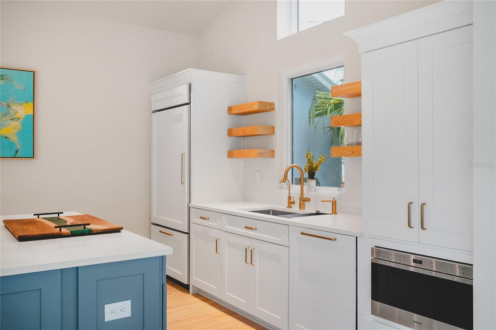 Kitchen with custom cabinetry and high end appliances