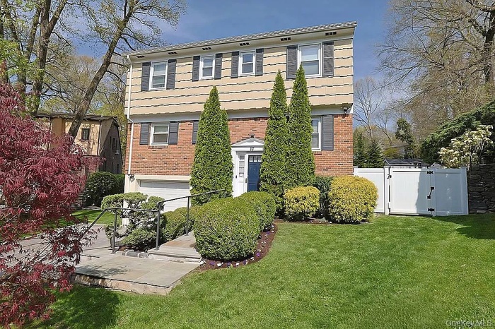 Meticulous Landscaping| View of one Gate to Backyard