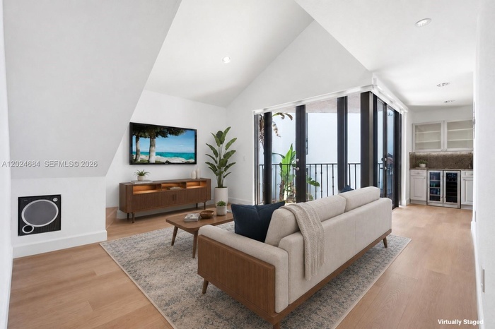 Welcome to this special unit with a Loft, 17 ft. vaulted ceilings and ample light. Motorized shades for the double doors in Living Area & Kitchen.