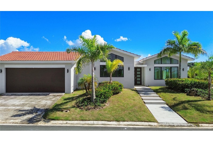 This home features the newest Casona del Lago floor plan in a corner-lot configuration