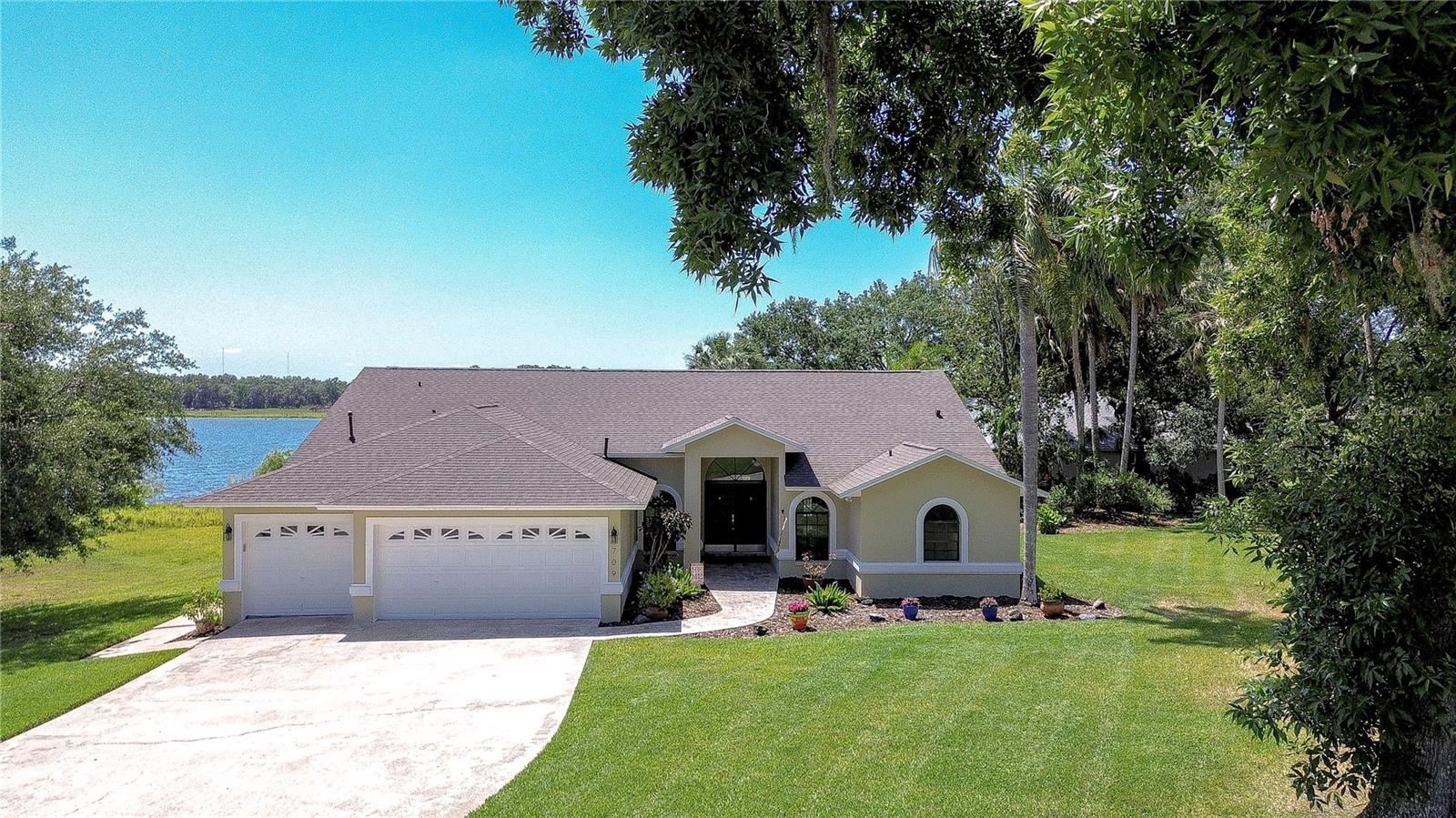 Tranquil Lakefront Setting with Mature Trees
