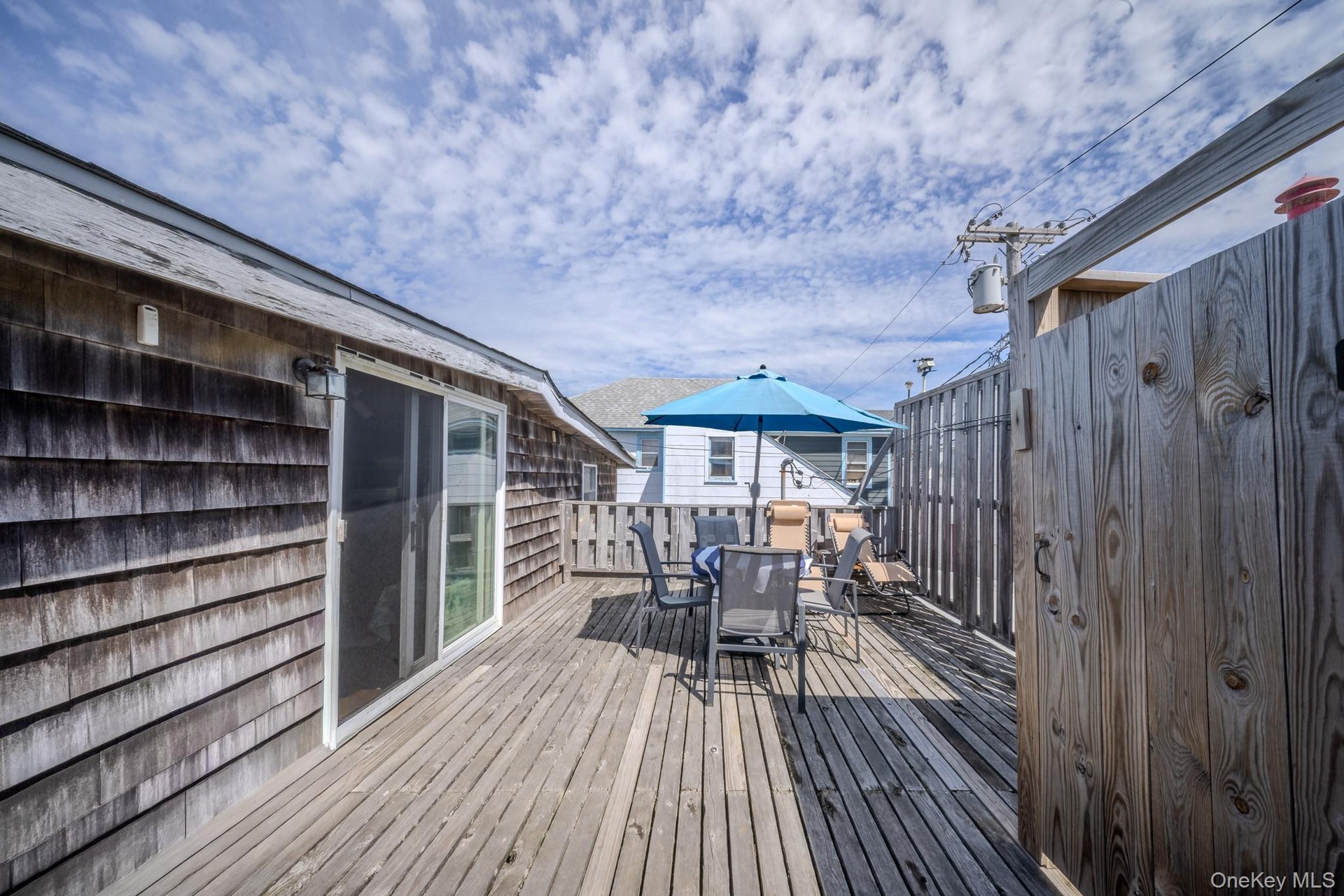 Deck Area with Outdoor Shower / Entrance to Apartment