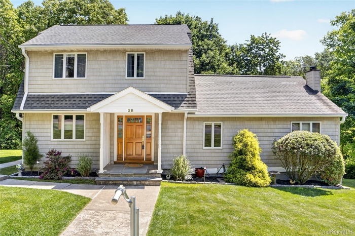 This colonial type home at 30 Brandeis with curb appeal all around.