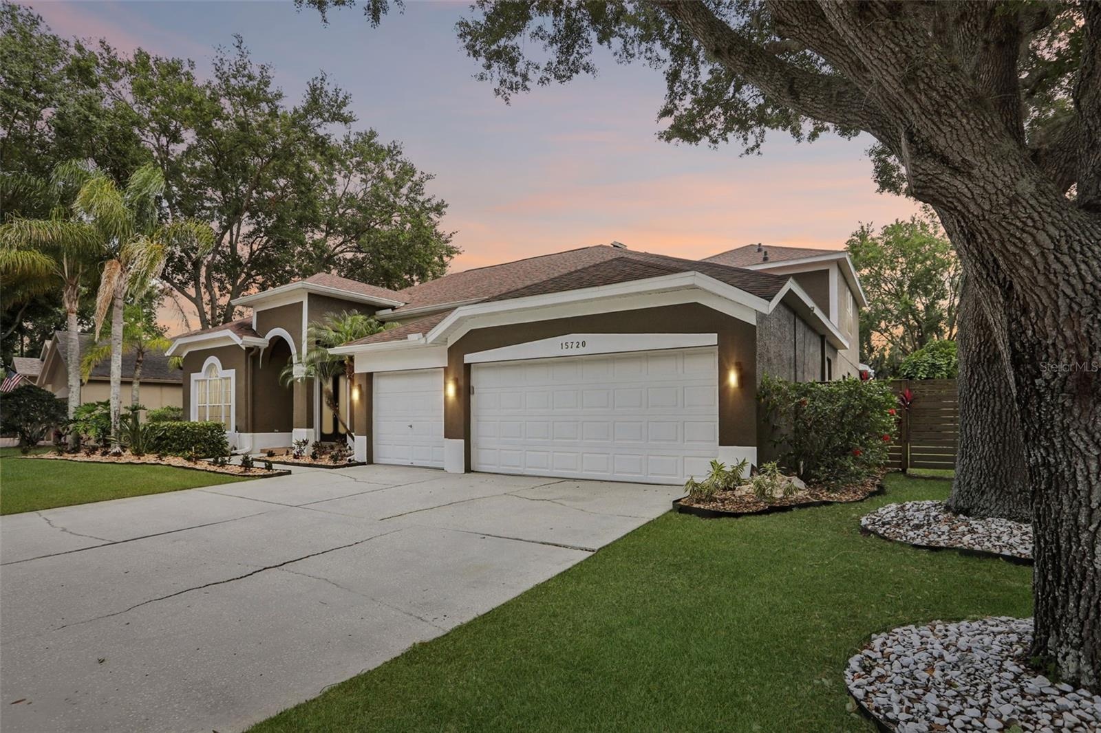 Generous 3 Car Garage and Mature Oaks