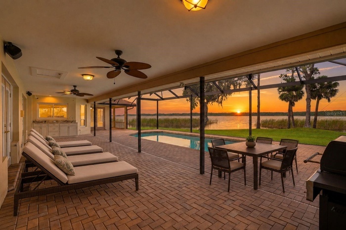 These views, the sunrise everyday. Covered Lanai and highvelocity pool enclosure withpaver pool deck and PebbleTecpool offers year roundenjoyment-virt