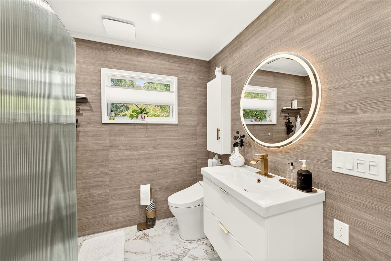 Primary in suite bathroom with Toto Bidet and a vanity that stores everything!