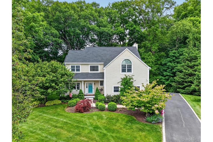 Beautifully landscaped Colonial set on a private cul-de-sac in desirable Croton-on-Hudson.