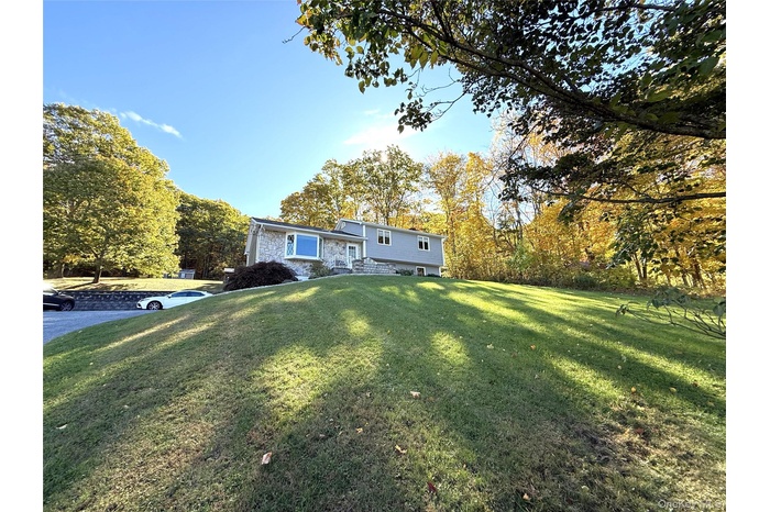 Set back from the road and located on 2.6 lovely acres.