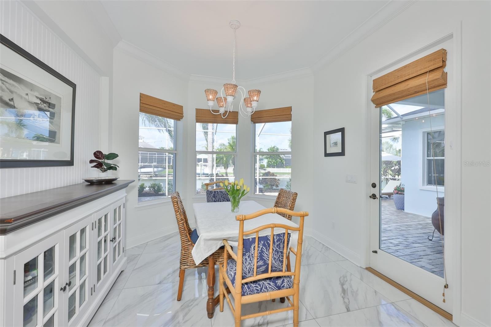 breakfast room/nook with view of backyard and canal