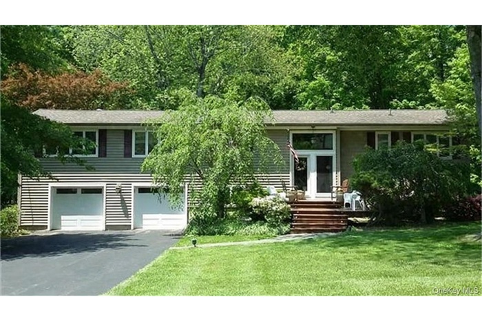 Welcome home to this lovingly maintained expanded raised ranch