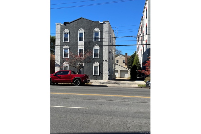 View of property with a garage