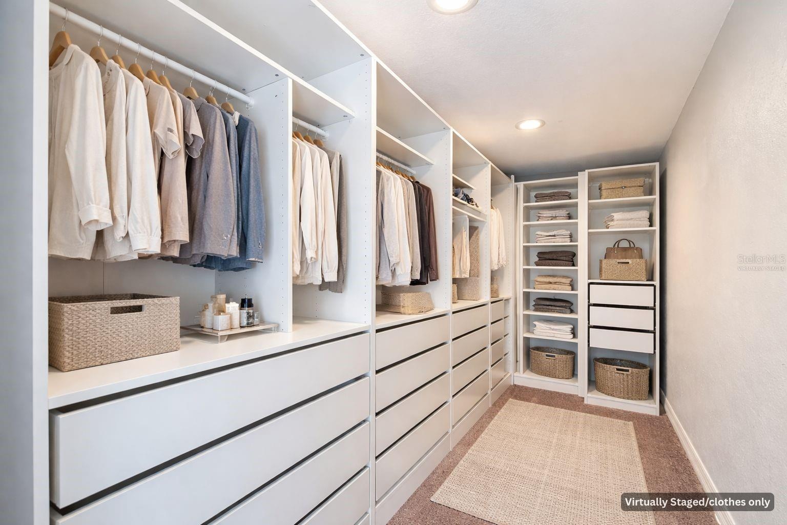 Primary Suite Closet/virtually staged with clothes only