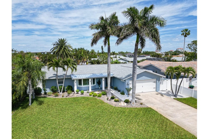 Manicured curb appeal, pristine coastal home