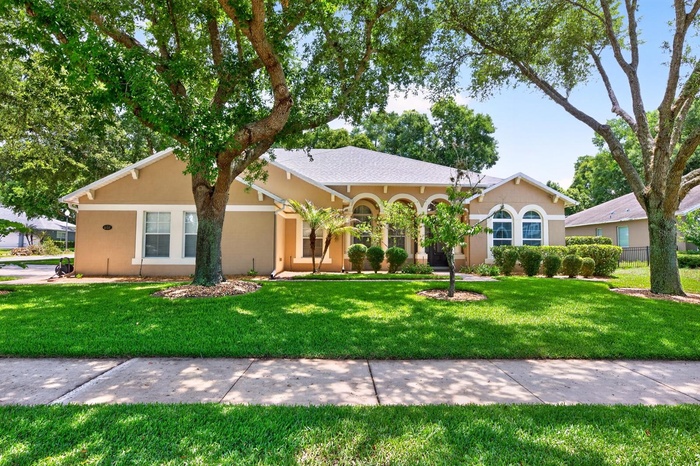 Situated on a private .35 ACRE ~ CORNER LOT with mature trees and a partially fenced backyard, this 5-bedroom, 4-bath home delivers over-the-top funct