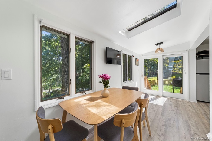 Dining area off the kitchen with sliding doors out to fenced in backyard