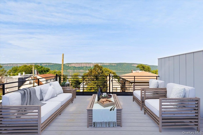 Expansive private rooftop terrace with breathtaking Hudson River and Palisades views-perfect for outdoor entertaining