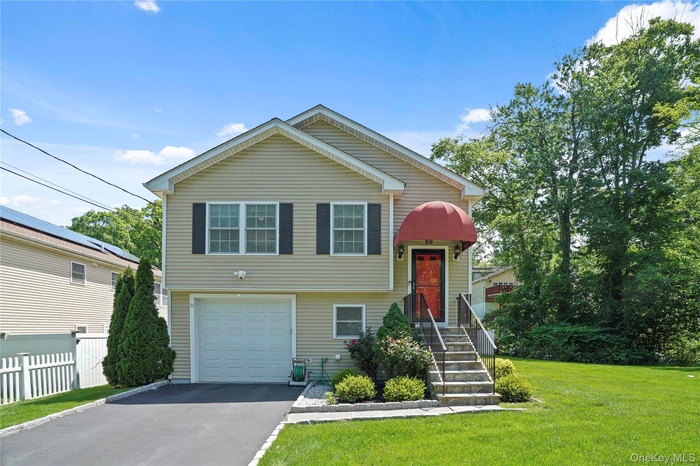 Lovely home on corner lot with manicured grounds.