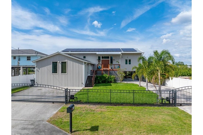 Unique curb appeal with modern and natural elements.