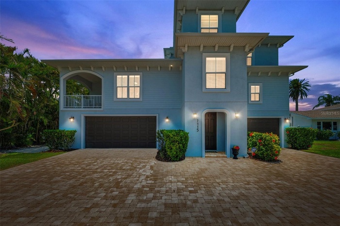 This quality 2018-built St Pete Beach waterfront estate has beautiful curb appeal in the front, and a dreamy wide open panoramic water view in the bac