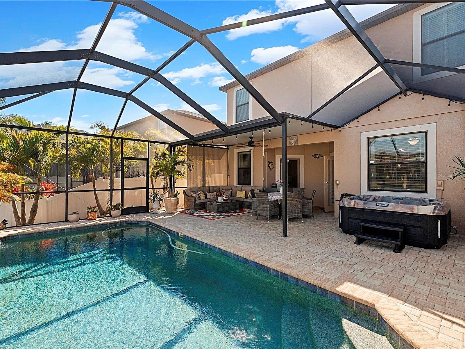 Covered Lanai overlooking pool and pond