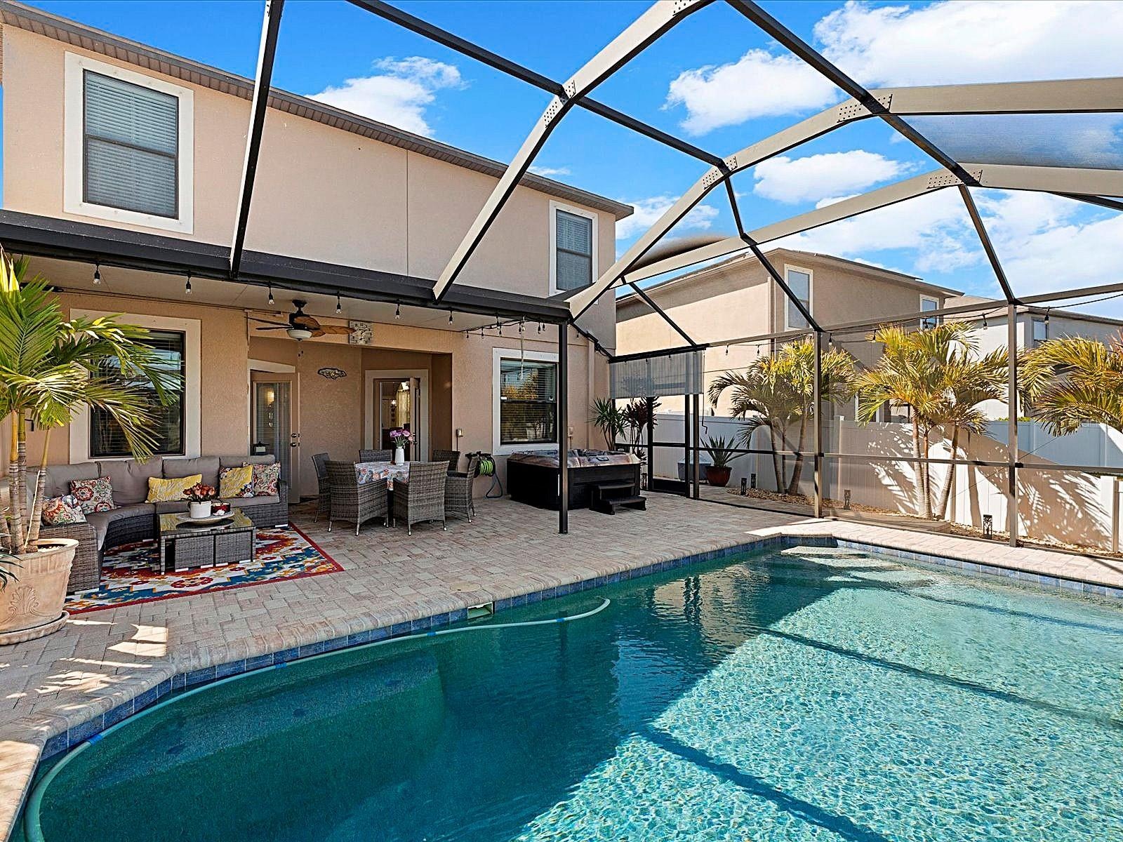 Covered Lanai overlooking pool and pond