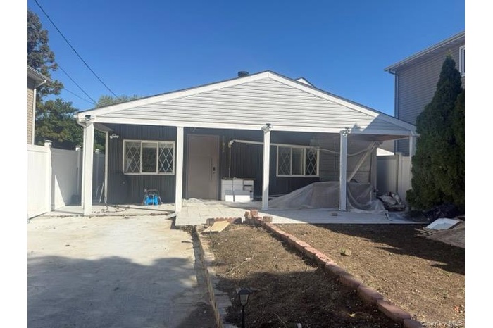 Rear view of house featuring a patio