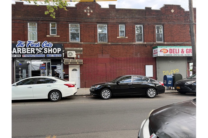 FRONT BUILDING 3 STORES 2 APTS