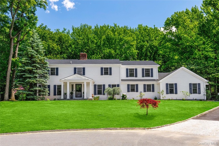 The stately Colonial architecture blends classic lines with eye-catching curb appeal.