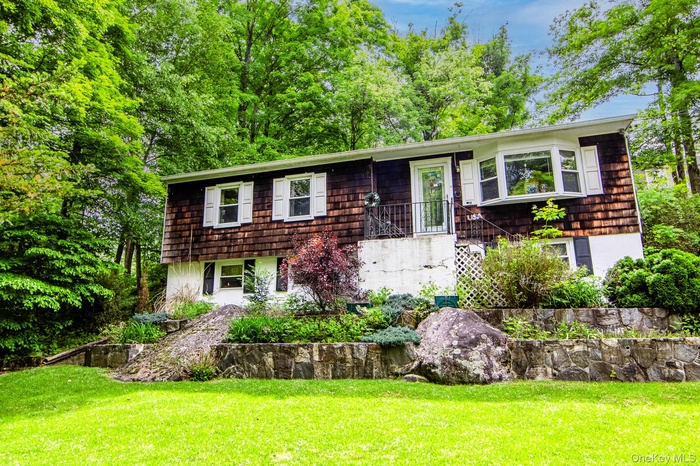 Beautiful flat front yard with stone retaining walls