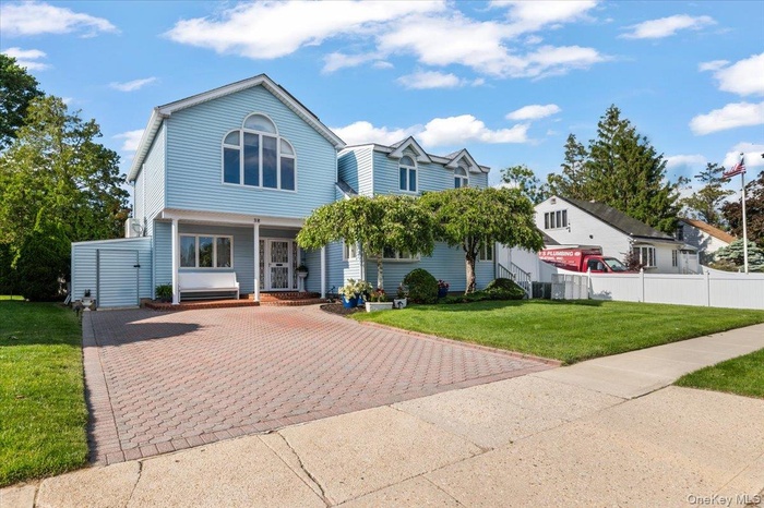 South Facing with 4 Car Paver Driveway