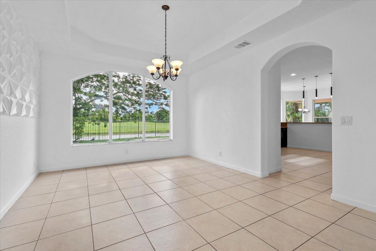 FORMAL DINING ROOM WITH A LAKE VIEW