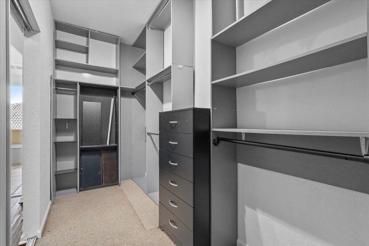 EN-SUITE WALK-IN CLOSET INSIDE THE MASTER BEDROOM SUITE ON SECOND FLOOR