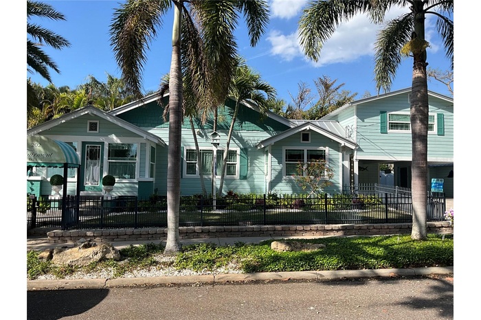 Street view, with the apartment over the carport