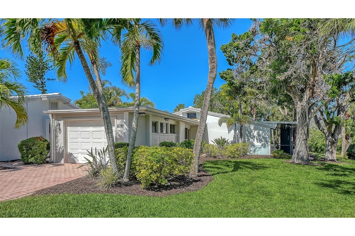 239 Hourglass Way is nestled in a peaceful, private setting overlooking the lagoon that runs through Whispering Sands.