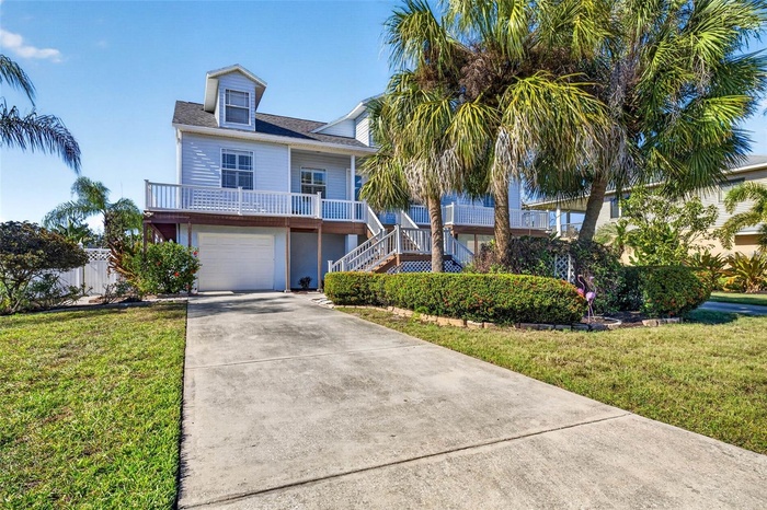 Plenty of parking with dual driveways leading to dual tandem garage