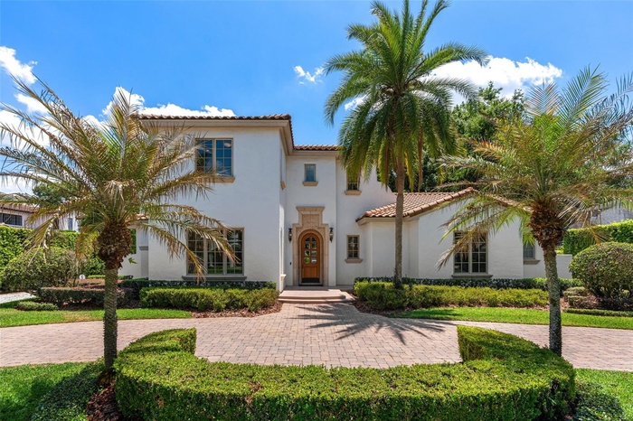 Nestled on a quiet, brick paved street, this house is on  a .34 acre lot with mature landscaping offering privacy