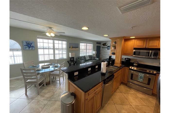 kitchen / dining area with unobstructed water views