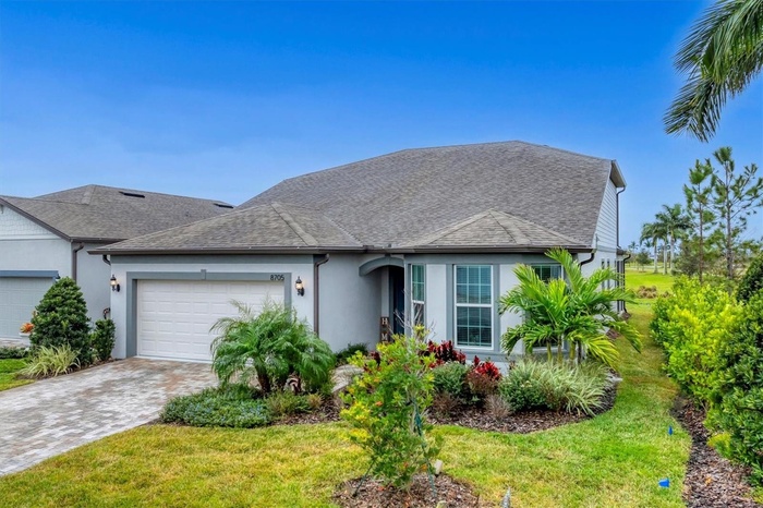 Bay window adds extra square footage and charm to the Mystique Grand elevation- Do note the landscaping on the side