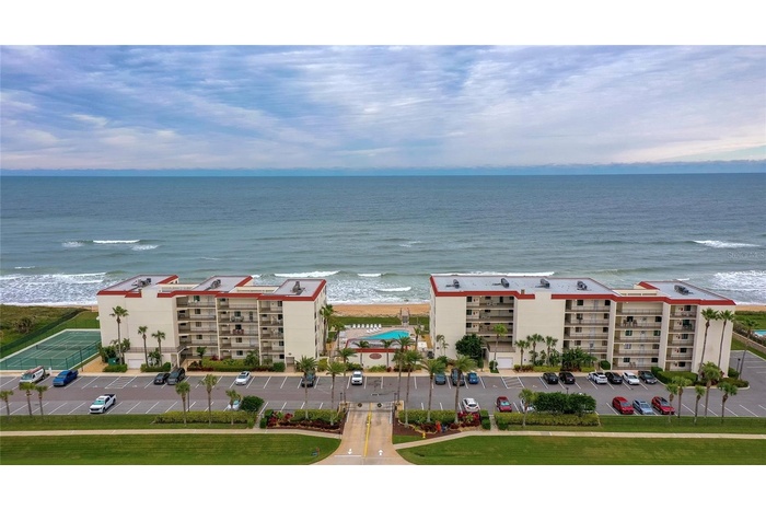 This beautifully maintained oceanfront community features two mid-rise buildings, a central pool area, and tennis courts—all nestled along the coast w