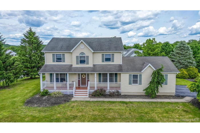 Two-story Colonial in The Ponds subdivision, featuring a rocking chair front porch and four bedrooms, two and a half bathrooms. Come see all this beau
