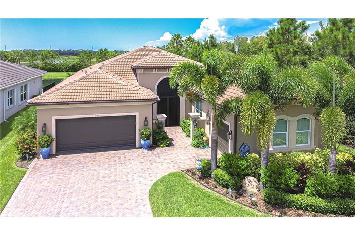 Stunning luxury residence located in gated Valencia Del Sol.