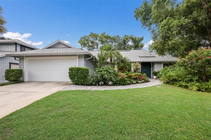 One story beautifully landscaped single family home.