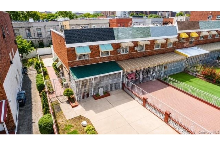 Aerial view of this well-maintained semi-detached single-family home featuring 3 bedrooms, 2 baths, over 1,300 square feet of living space, and the co