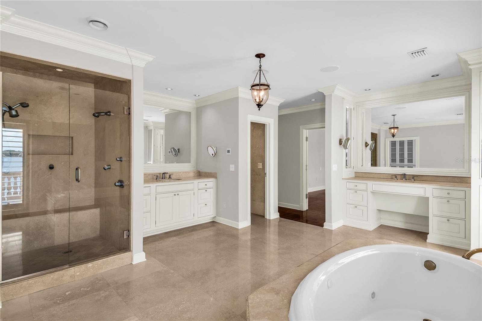 Primary suite with private balcony, huge en suite bathroom and walk-in closet