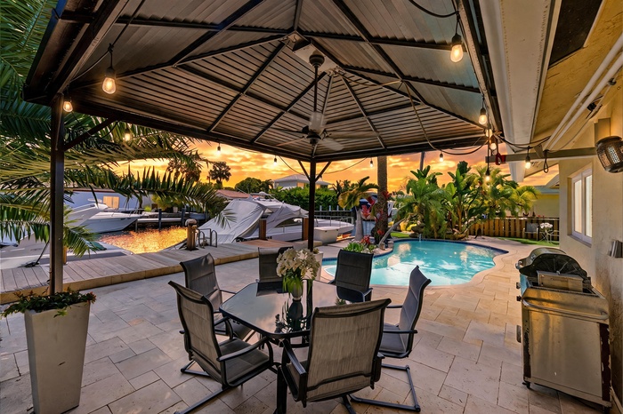 Discover the Ultimate South Florida Waterfront Lifestyle in sought after Snug Harbor, where small town charm meets coastal luxury just minutes from Fo