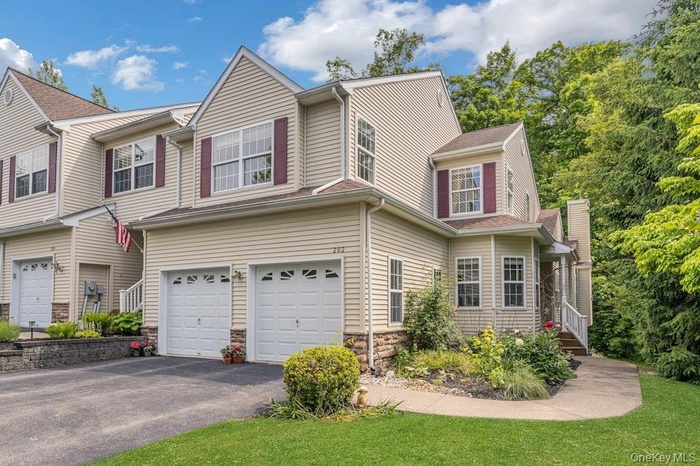 STOP!  Are you on the hunt for a townhouse with 4 bedrooms, 2 full and 2 half baths with a finished walk-out lower level and a two-car garage?