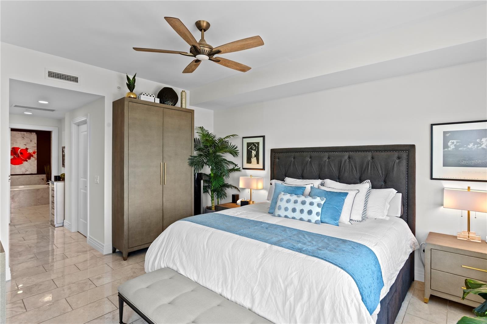Primary Bedroom with Ensuite, Walk-in closet, and open water views of Tampa Bay