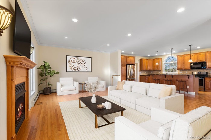 Virtually staged. Large open space living room, gas fireplace open to the kitchen and more